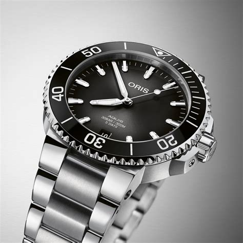 Rolex Submariner 124060 Vs. Oris Aquis Caliber 400 